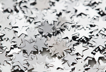 Image showing Scattered glittering stars confetti