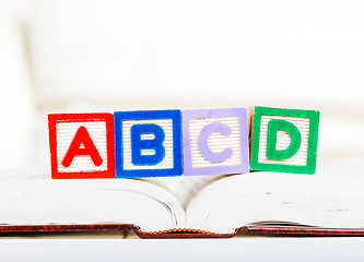 Image showing Alphabet block with ABCD on book