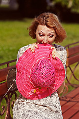 Image showing Girl with red elements of clothing