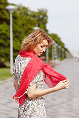 Image showing Girl with red elements of clothing