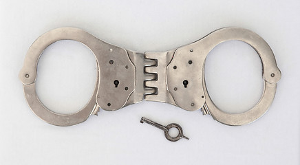 Image showing Old handcuffs and key 