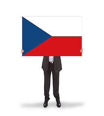 Image showing Smiling businessman holding a big card, flag of the Czech Republ