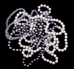 Image showing White, black and grey pearls on the black silk 