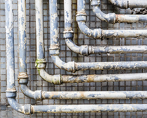 Image showing Old pipes on wall