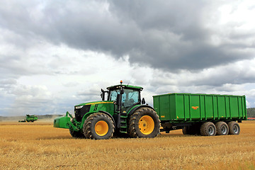 Image showing John Deere Tractor and Combine Harvesting