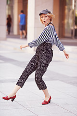 Image showing Beautiful girl in the striped vest