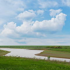 Image showing cloudy blue sky and winding river