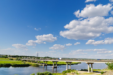 Image showing bridge over river and blue sky
