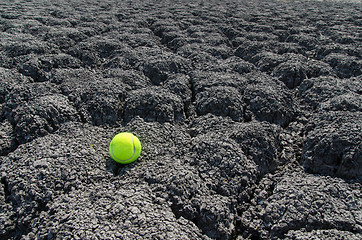 Image showing tennis ball on cracked land