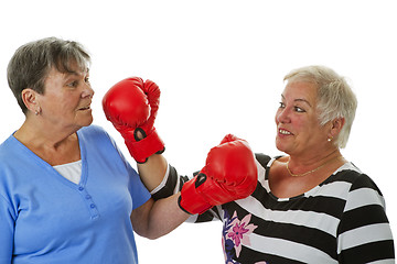 Image showing Two female seniors with red boxing glove