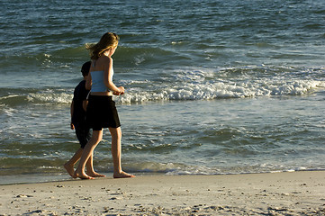 Image showing Strolling along the waves