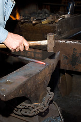 Image showing Hammering glowing steel