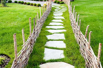 Image showing old-fashioned alley with green grass