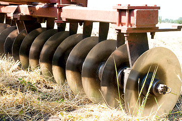 Image showing closeup agricultural machine on the field