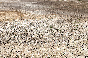 Image showing black cracked waterless earth