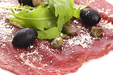 Image showing Beef carpaccio with rucola and parmesan 