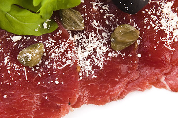 Image showing Beef carpaccio with rucola and parmesan 