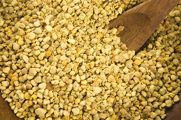 Image showing Bee pollen in wooden scoop. Nutritional supplement