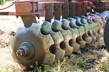 Image showing closeup agricultural machine on the field