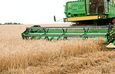 Image showing combine harvester working a wheat field