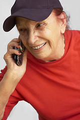Image showing active grandmama speaking on the mobile phone