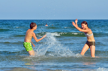 Image showing children splashing at the sea