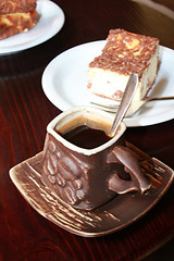 Image showing cup of coffee and portion of cake