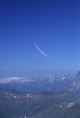 Image showing Glider plane turning over Pyrenees mountain