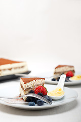 Image showing tiramisu dessert with berries and cream