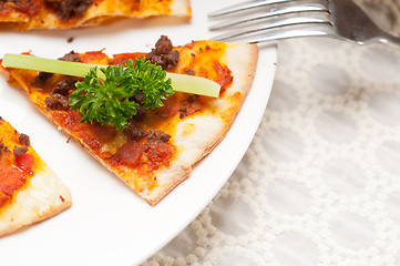 Image showing Turkish beef pizza with cucumber on top