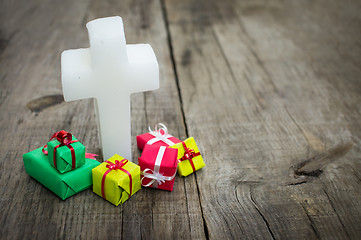 Image showing Religious cross with presents