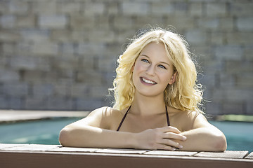 Image showing Happy blond girl in pool