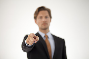 Image showing Smiling Young Businessman Pointing at the Camera