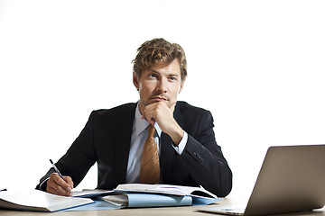 Image showing Businessman working out a problem