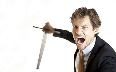 Image showing Crazy businessman attacking with sword