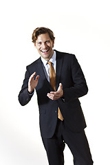 Image showing Laughing businessman clapping his hands