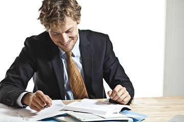 Image showing Businessman reading something funny