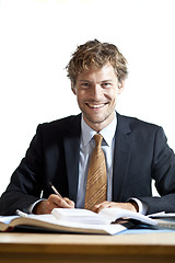 Image showing Smiling businessman at work
