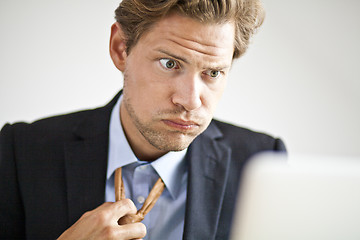 Image showing Overworked businessman