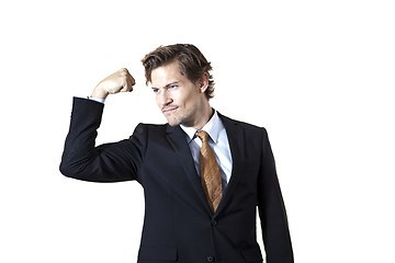 Image showing Strong businessman flexing