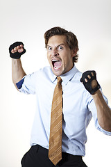 Image showing Brutish businessman ready to punch