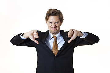 Image showing Unhappy businessman giving thumbs down