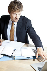 Image showing Businessman reaching for laptop at work