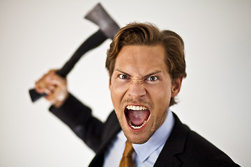 Image showing Businessman Wielding Axe