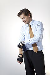 Image showing Brute businessman pulling up sleeves