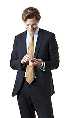 Image showing Happy businessman texting