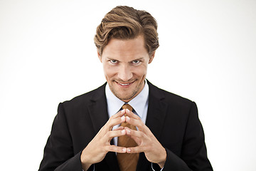 Image showing  Contemplating Businessman holding fingers together in front