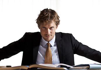 Image showing Focused businessman sitting at desk