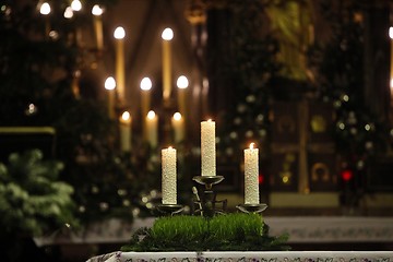 Image showing Burning candles on church altar