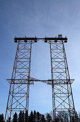 Image showing Big double electricity pylon in the forest
